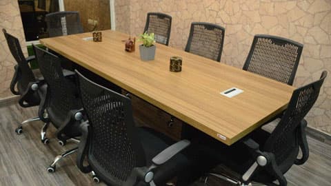 Conference room with a long table and twelve chairs